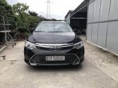 Bán xe Toyota Camry năm 2015, màu đen, giá thấp động cơ ổn định 