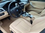 Cần bán lại xe BMW 320i sản xuất năm 2013, màu đen, nhập khẩu, giá 680tr