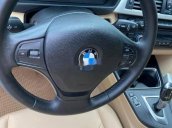 Cần bán lại xe BMW 320i sản xuất năm 2013, màu đen, nhập khẩu, giá 680tr