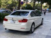 Bán BMW 320i 2014 trắng kem 26000km siêu mới