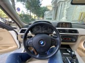 Bán BMW 320i 2014 trắng kem 26000km siêu mới