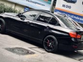 Bán xe BMW 320i 2013, màu đen, giá tốt