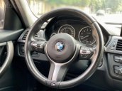 Cần bán xe BMW 320i sản xuất năm 2013 màu đen, giá tốt