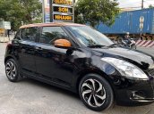 Bán ô tô Suzuki Swift sản xuất năm 2014, màu đen còn mới