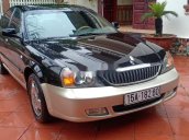 Cần bán lại xe Daewoo Magnus đời 2004, màu đen, 125tr