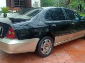 Cần bán lại xe Daewoo Magnus đời 2004, màu đen, 125tr