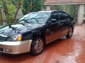 Cần bán lại xe Daewoo Magnus đời 2004, màu đen, 125tr