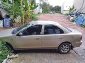 Cần bán lại xe Mazda 323 đời 1999, màu vàng