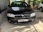 Cần bán Kia Spectra năm sản xuất 2005, màu đen chính chủ