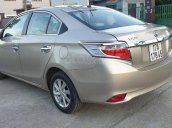 Cần bán gấp Toyota Vios đời 2014, màu ghi vàng