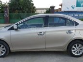 Cần bán gấp Toyota Vios đời 2014, màu ghi vàng