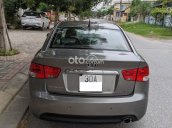 Cần bán xe Kia Cerato 1.6 AT 2010, màu xám xe chính chủ