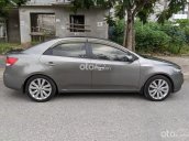 Cần bán xe Kia Cerato 1.6 AT 2010, màu xám xe chính chủ