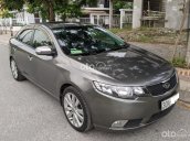 Cần bán xe Kia Cerato 1.6 AT 2010, màu xám xe chính chủ