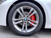 Cần bán xe BMW 320i năm 2013, màu trắng, 899 triệu