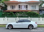 Cần bán xe BMW 320i năm 2013, màu trắng, 899 triệu