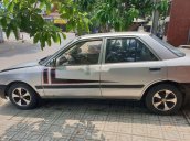 Cần bán lại xe Mazda 323 đời 1995, hai màu trắng xám