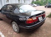 Bán ô tô Mazda 323 đời 2000, màu đen, xe nhập