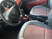 Bán xe Hyundai Grand i10 1.2 AT sản xuất năm 2015, màu trắng, nhập khẩu nguyên chiếc còn mới