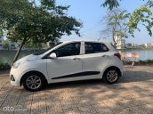 Bán xe Hyundai Grand i10 1.2 AT sản xuất năm 2015, màu trắng, nhập khẩu nguyên chiếc còn mới