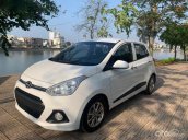 Bán xe Hyundai Grand i10 1.2 AT sản xuất năm 2015, màu trắng, nhập khẩu nguyên chiếc còn mới