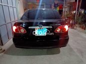 Cần bán Toyota Corolla 1.8E MT năm 2004, màu đen