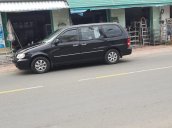 Cần bán Kia Carnival AT năm 2009, màu đen, 235 triệu