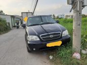 Cần bán Kia Carnival AT năm 2009, màu đen, 235 triệu