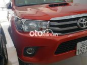 Bán ô tô Toyota Hilux E MT sản xuất 2016, màu đỏ chính chủ, giá chỉ 525 triệu