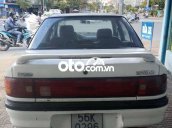 Bán ô tô Mazda 323 sản xuất 1995, màu trắng, nhập khẩu