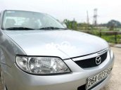 Cần bán gấp Mazda 323 năm sản xuất 2004, màu bạc, xe nhập giá cạnh tranh