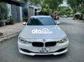 BMW 320i trắng kem 2014