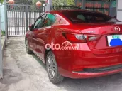 Mazda 2 1.5 AT đỏ mận nhập khẩu Thái Lan.