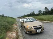 Ô tô Chevrolet Cruze 2011 số sàn màu vàng cát
