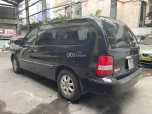 Bán xe Kia Carnival 2.5 AT 2008 - Màu đen, máy 2.5AT, bản GS - 2 ghế giửa xoay 360 độ, nội thất rộng rãi, bọc lại nệm da 2 màu,