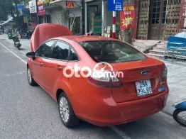 Ford Fiesta 2011 màu cam đỏ đã lăn bánh
