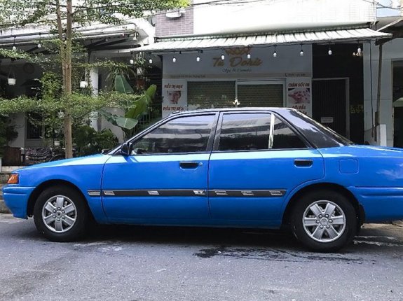 Cần bán Mazda 323 năm 1995, màu xanh lam, nhập khẩu chính chủ giá cạnh tranh