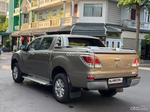 Mazda BT-50 Deluxe 4x2 2.2 AT 2015 - Bán xe bán tải nhập Thái màu vàng đẹp