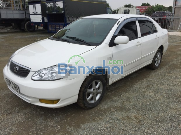 Cần bán xe Toyota Corolla J, màu trắng, sản xuất năm 2003