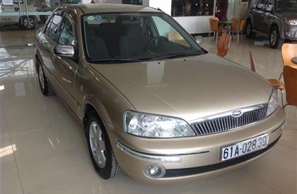 Cần bán lại xe Ford Laser đời 2003, màu vàng