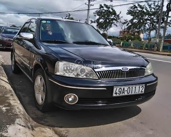 Cần bán gấp Ford Laser 1.8MT sản xuất 2003, màu đen như mới