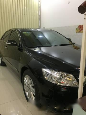 Bán xe cũ Toyota Camry 3.5Q năm 2010, màu đen chính chủ, giá tốt