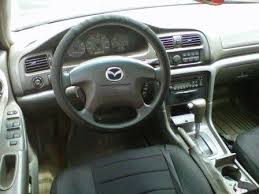 Cần bán gấp Mazda 2002, màu nâu, một đời chủ