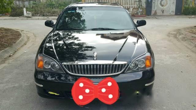 Cần bán xe Daewoo Magnus đời 2004, màu đen xe gia đình