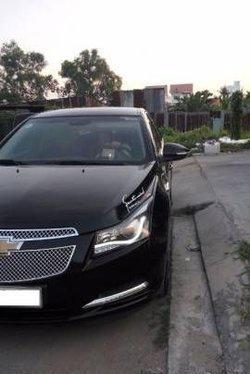 Tôi cần bán Chevrolet Cruze MT đời 2010, màu đen số sàn