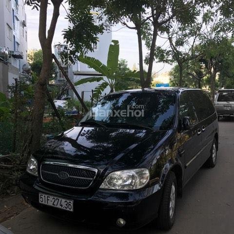 Bán xe Kia Carnival 2009 máy xăng màu đen, tặng thêm phụ kiện