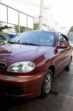 Gia đình cần bán lại xe Daewoo Lanos MT đời 2004, màu đỏ 