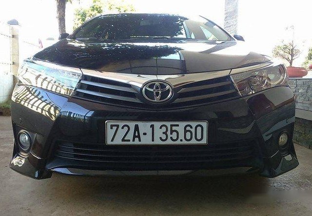 Bán xe chính chủ Toyota Corolla altis AT đời 2015, màu đen, giá chỉ 800 triệu