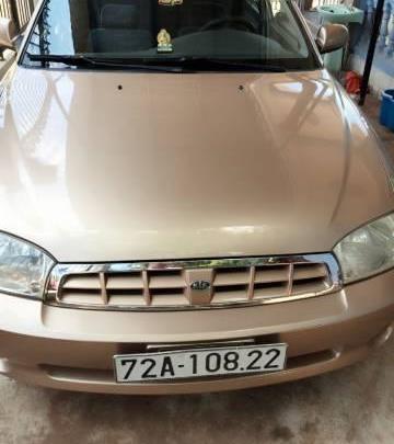 Gia đình bán xe Kia Spectra đời 2004, màu vàng