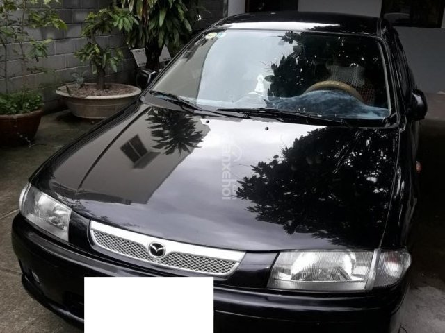 Bán ô tô Mazda 323 đời 1999, màu đen, nhập khẩu chính hãng giá cạnh tranh